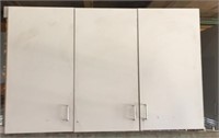 Three upper light gray laminate cabinets