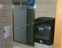 Soap and towel dispensers and mirror.