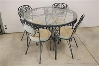 Wrought Iron glass top patio table and chairs