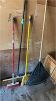 3 brooms, dust pan and rake