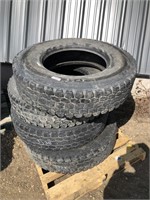 Four 11R22.5 semi tires