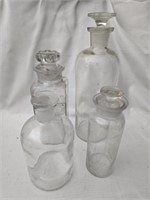 Lot of 4 clear glass bottles