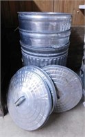 4 galvanized trash cans w/ lids