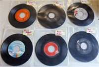 Box of 45 records in plastic sleeves,