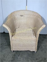 Large beige wicker chair