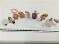 Perfume bottles, lighter and candleholder