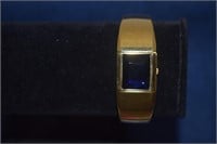 Gold Toned Clamp Bracelet w/ Blue Stone & Watch