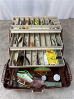 Assortment of fishing lures and Plano tackle box