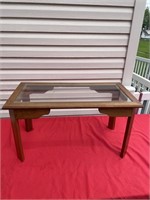 Small wooden glass top table