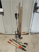 Assortment of garden tools and loppers