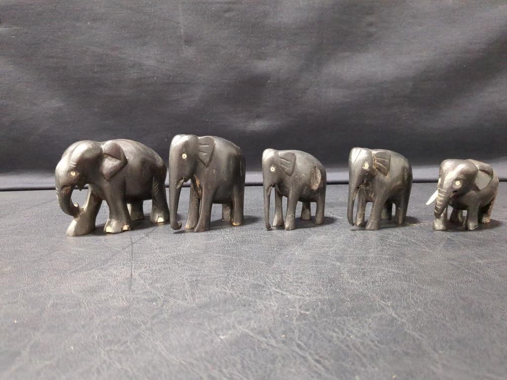 Elephants - look to be wood carved, some t