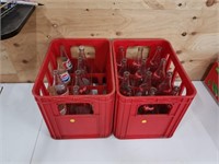 2 pop shoppe crates with bottles