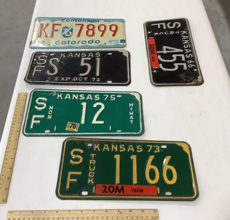4 Kansas license plates w/ 1 Colorado plate