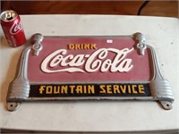 modern cast iron Coke sign