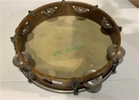 Vintage wood and metal tambourine, with a good