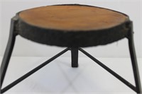 Primitive hand-made hammered iron and wood stool