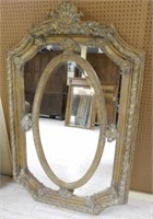 Ornate Gilt Framed Oval Centered Mirror.