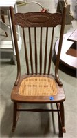 Wooden rocking chair with wicker seat