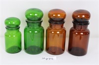 4 colored glass jars with lids