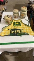 John Deere cooking apron, decorative canisters.