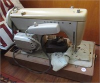Singer sewing machine with foot pedal. Note: No