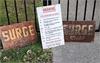 2 surge signs and porcelain warning sign