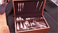 Box of silverplate flatware and a candle snuffer