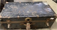 BLACK METAL TRUNK, SOME DENTS, 31" W X 16" D X