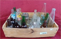 Vintage bottles and jars with wooden crate,