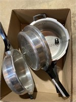 2 pressure cookers and a 3 qt pan