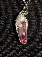 Pink faceted crystal pendant On a silver chain