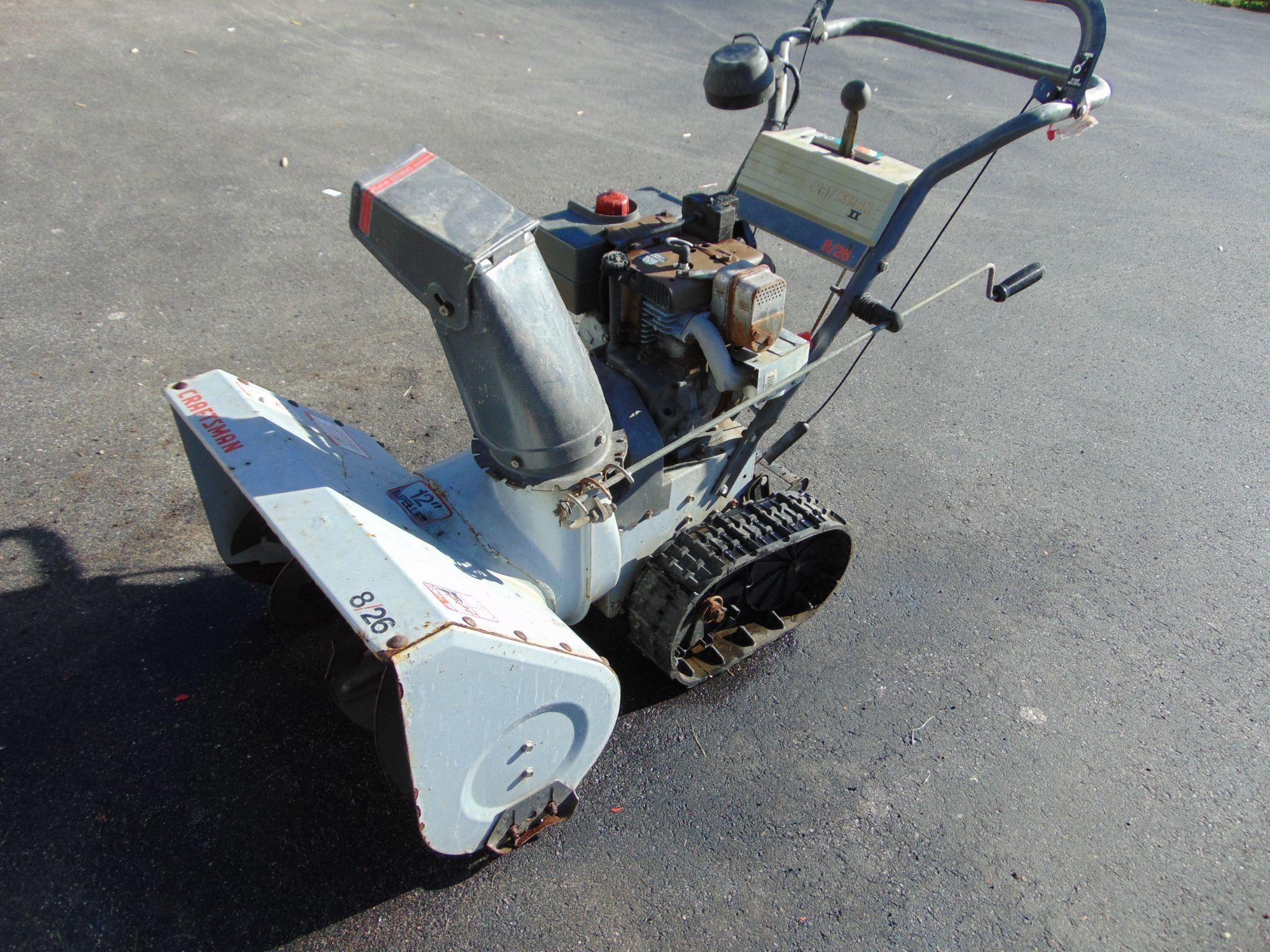 Tracked snowblower. Likely needs work.
