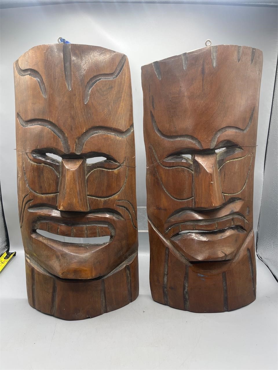 Pair of Wooden tiki mask wall hangings