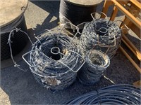 SPOOLS OF BARB WIRE FENCE