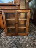 Glass front wooden display cabinet