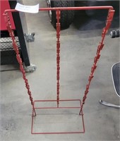 TALL RED METAL STAND WITH CLIPS FOR DISPLAY