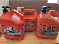 3 containers of orange hand cleaner