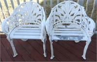 Pair of white decorated garden seats