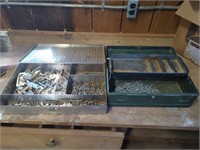 Two small tool boxes full of nails and screws