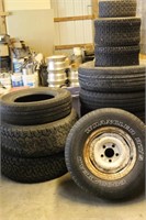 stack of misc tires assorted sizes