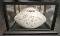 Troy trojans signed football in glass case