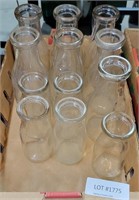 FLAT OF CLEAR GLASS MILK BOTTLES