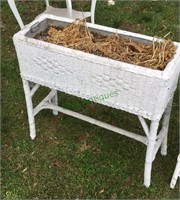 Lawn planter - antique wicker lawn planter.