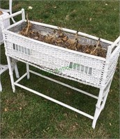 Lawn planter - antique wicker lawn planter.