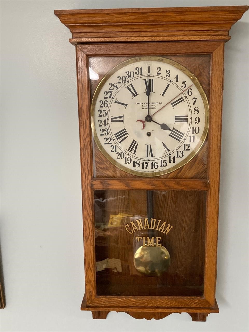Pequegnat clock. With key. No info. 16” x 36”