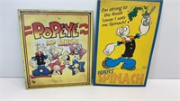 Two 1990s metal Popeye metal signs. Both have
