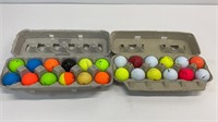 2 dozen golf balls, various brands.