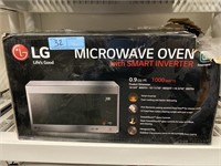LG microwave oven, has damage on back corner