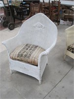 wicker chair with padded seat on springs