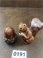 Salt and pepper Squirrel with acorn as pictured